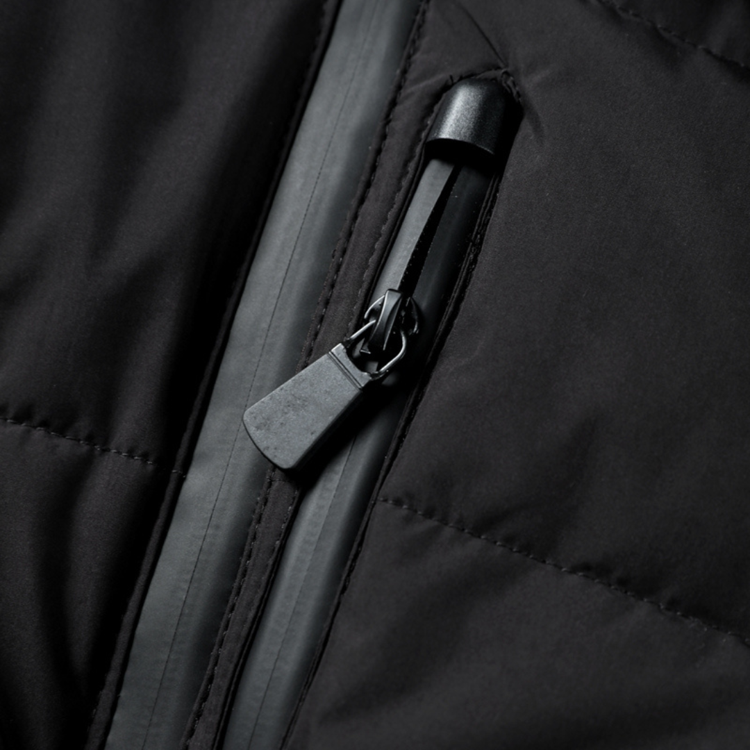 Unelma | Zwarte waterdichte pufferjas voor dames met riem in de taille, gewatteerde isolatie, winterjas