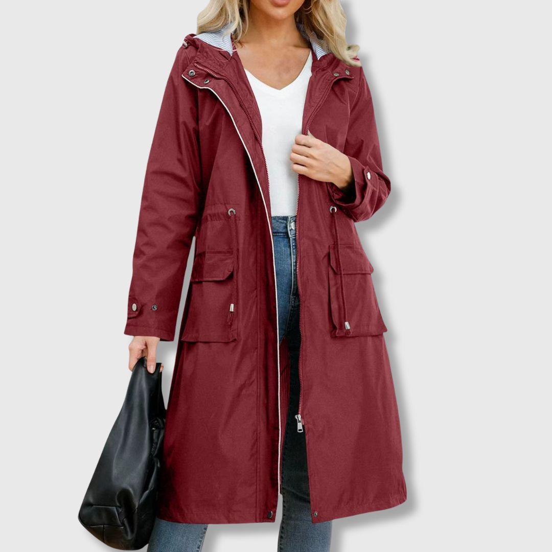 Benigna | Lange regenjas met capuchon voor dames – Waterdichte, casual outdoorjas met capuchon