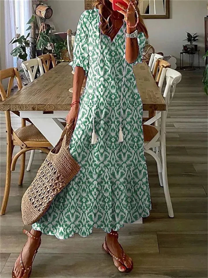 Tazira | Boho Maxi jurk met bloemen - Halflange mouwen, vloeiende relaxte zomerjurk