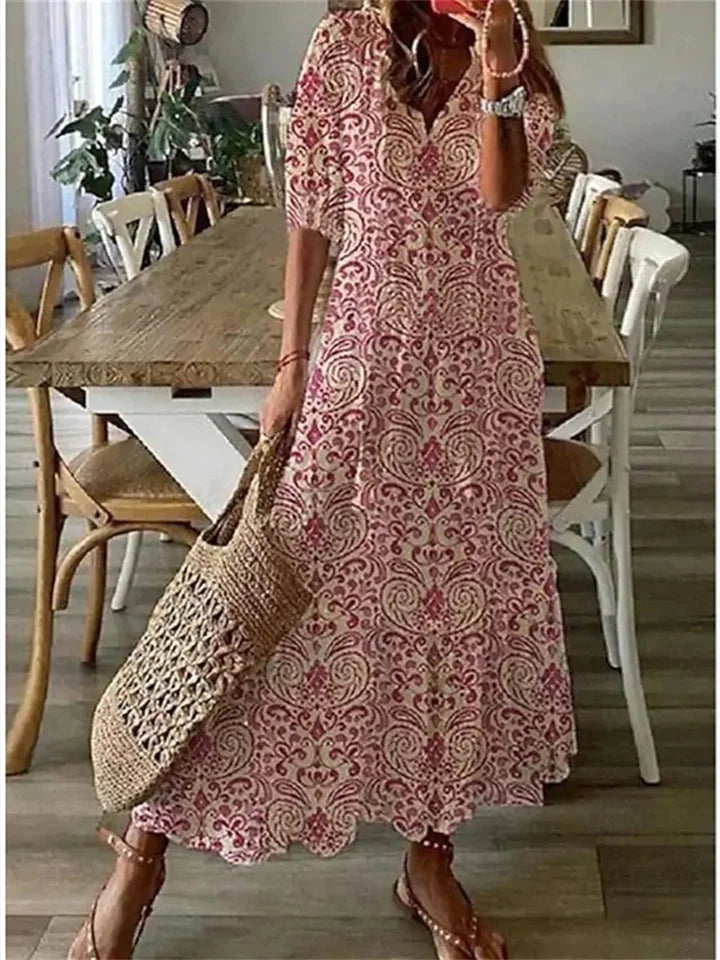 Tazira | Boho Maxi jurk met bloemen - Halflange mouwen, vloeiende relaxte zomerjurk