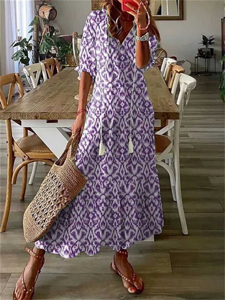 Tazira | Boho Maxi jurk met bloemen - Halflange mouwen, vloeiende relaxte zomerjurk