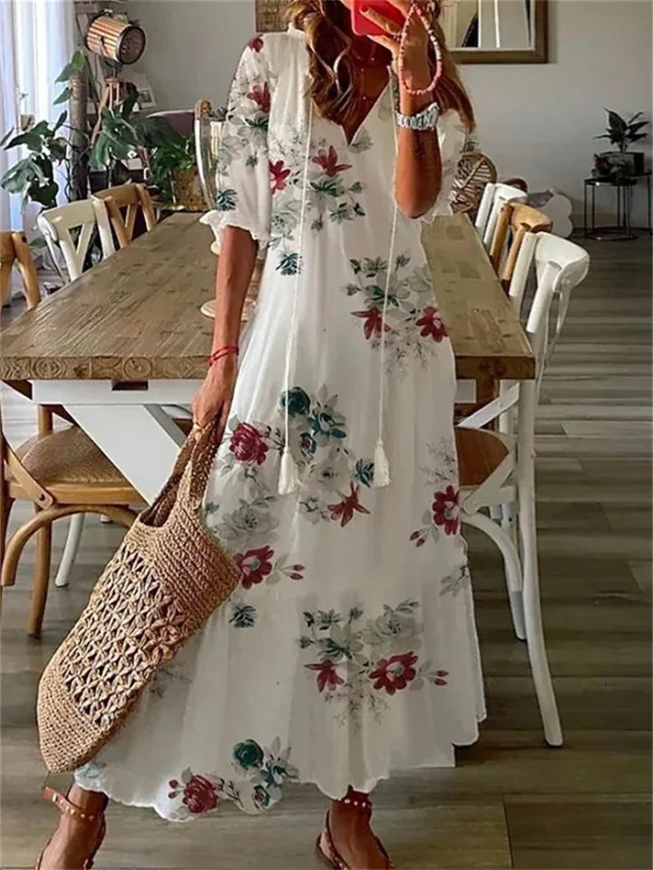 Tazira | Boho Maxi jurk met bloemen - Halflange mouwen, vloeiende relaxte zomerjurk