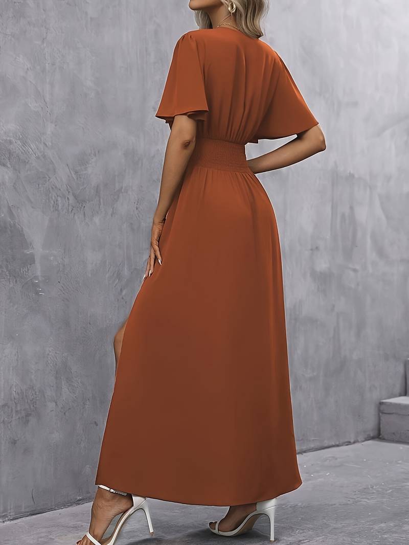 Taina | Elegante lange vloeiende damesjurk met split aan de zijkant en klokmouwen